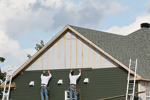 Professional Siding technician working in Rolesville, NC